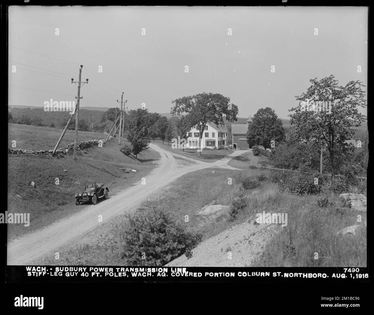 Wachusett Department, Wachusett-Sudbury power transmission line, stiff-leg guy, 40-foot poles, Wachusett Aqueduct, covered portion, Colburn Street, Northborough, Mass., Aug. 1, 1918 , waterworks, power lines, aqueducts, construction completed Stock Photo