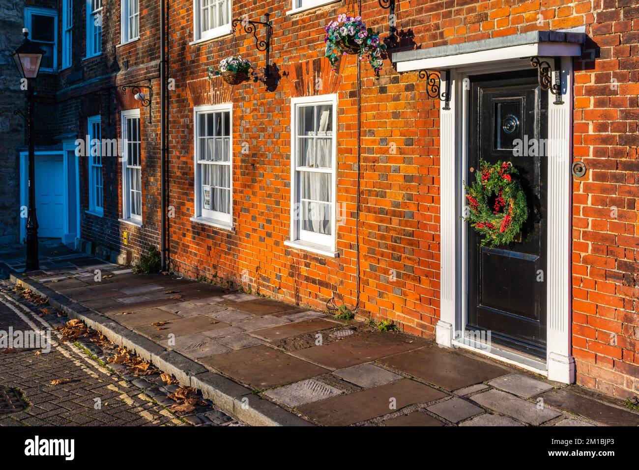 House facade at Christmas in Westgate Street situated amongst the
