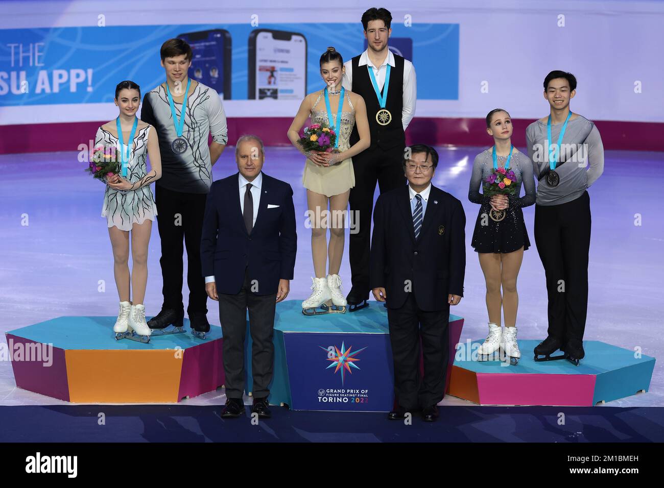 Turin, Italy. 10th Dec, 2022. Junior Pairs Medalists ( L to R ); Sophia Baram and Daniel Tioumentsev of USA ( Silver ), Anastasia Golubeva and Hektor Giotopoulos Moore of Australia ( Gold ) and Cayla Smith and Andy Deng of USA ( bronze ) pose with with; ( lower left ) Andrea Gios President of the Italian Ice Sports Federation ( FISG ) and ( lower right ) Mr. Tatsuro Matsumura of ISU Development Commission on the Winners' podium at Palavela, Turin. Picture date: 10th December 2022. Picture credit should read: Jonathan Moscrop/Sportimage Credit: Sportimage/Alamy Live News Stock Photo