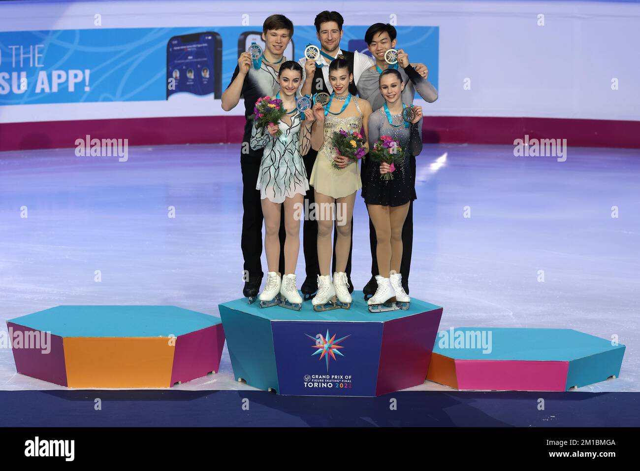 Turin, Italy. 10th Dec, 2022. Junior Pairs Medalists ( L to R ); Sophia Baram and Daniel Tioumentsev of USA ( Silver ), Anastasia Golubeva and Hektor Giotopoulos Moore of Australia ( Gold ) and Cayla Smith and Andy Deng of USA ( bronze ) pose with their medals on the Winners' podium at Palavela, Turin. Picture date: 10th December 2022. Picture credit should read: Jonathan Moscrop/Sportimage Credit: Sportimage/Alamy Live News Stock Photo