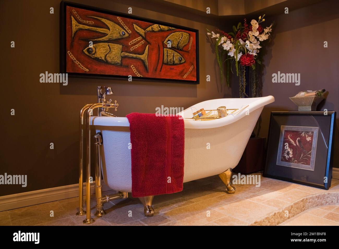 Old fashioned freestanding soaking bathtub on ceramic base in basement