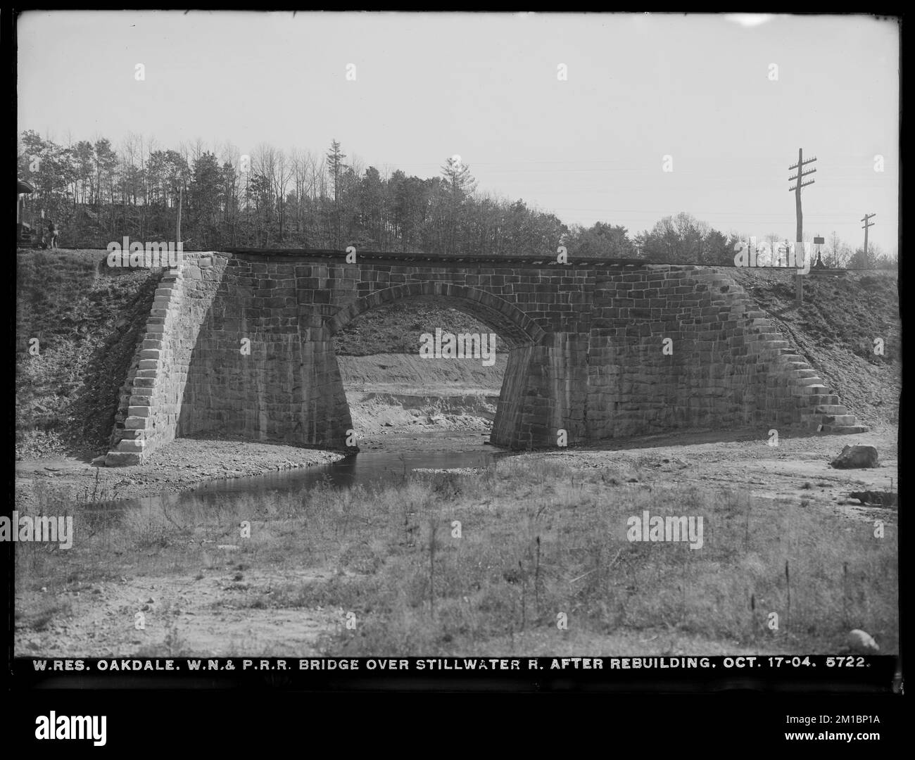 Wachusett Reservoir, Worcester, Nashua & Portland Railroad bridge over Stillwater River after rebuilding, Oakdale, West Boylston, Mass., Oct. 17, 1904 , waterworks, railroad bridges, arch bridges Stock Photo