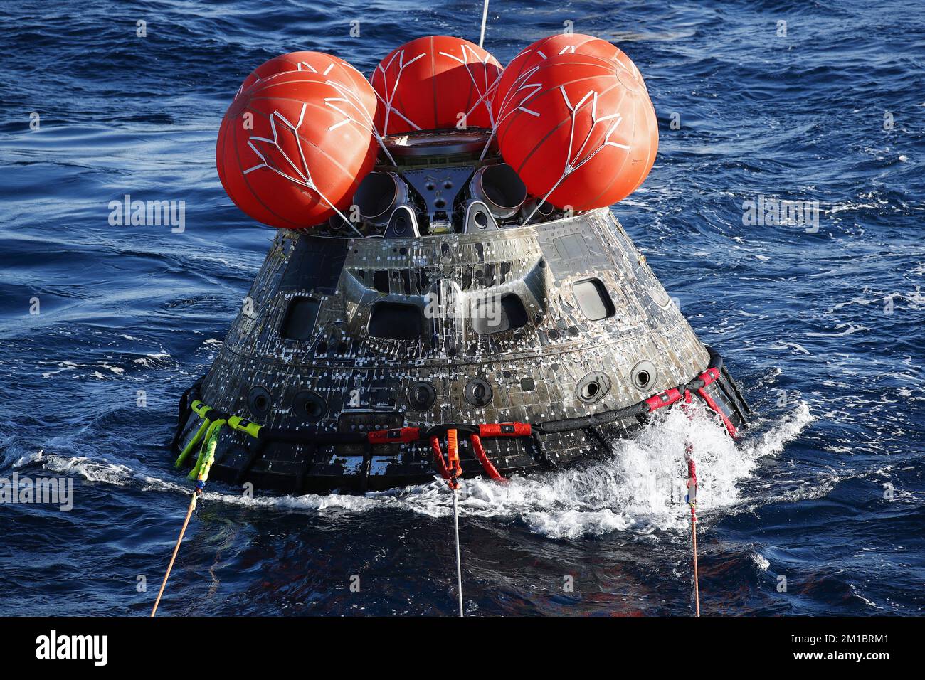 Baja California, Mexico, on Sunday, December 11, 2022. NASA's Orion Capsule is towed during recovery operations after it splashed down following a successful uncrewed Artemis I Moon Mission on Sunday, December 11, 2022, as seen from aboard the U.S.S. Portland in the Pacific Ocean off the coast of Baja California, Mexico. The 26-day Artemis I mission took the Orion spacecraft to the moon and back to complete a historic flight. Pool Photo by Mario Tama/UPI Credit: UPI/Alamy Live News Stock Photo