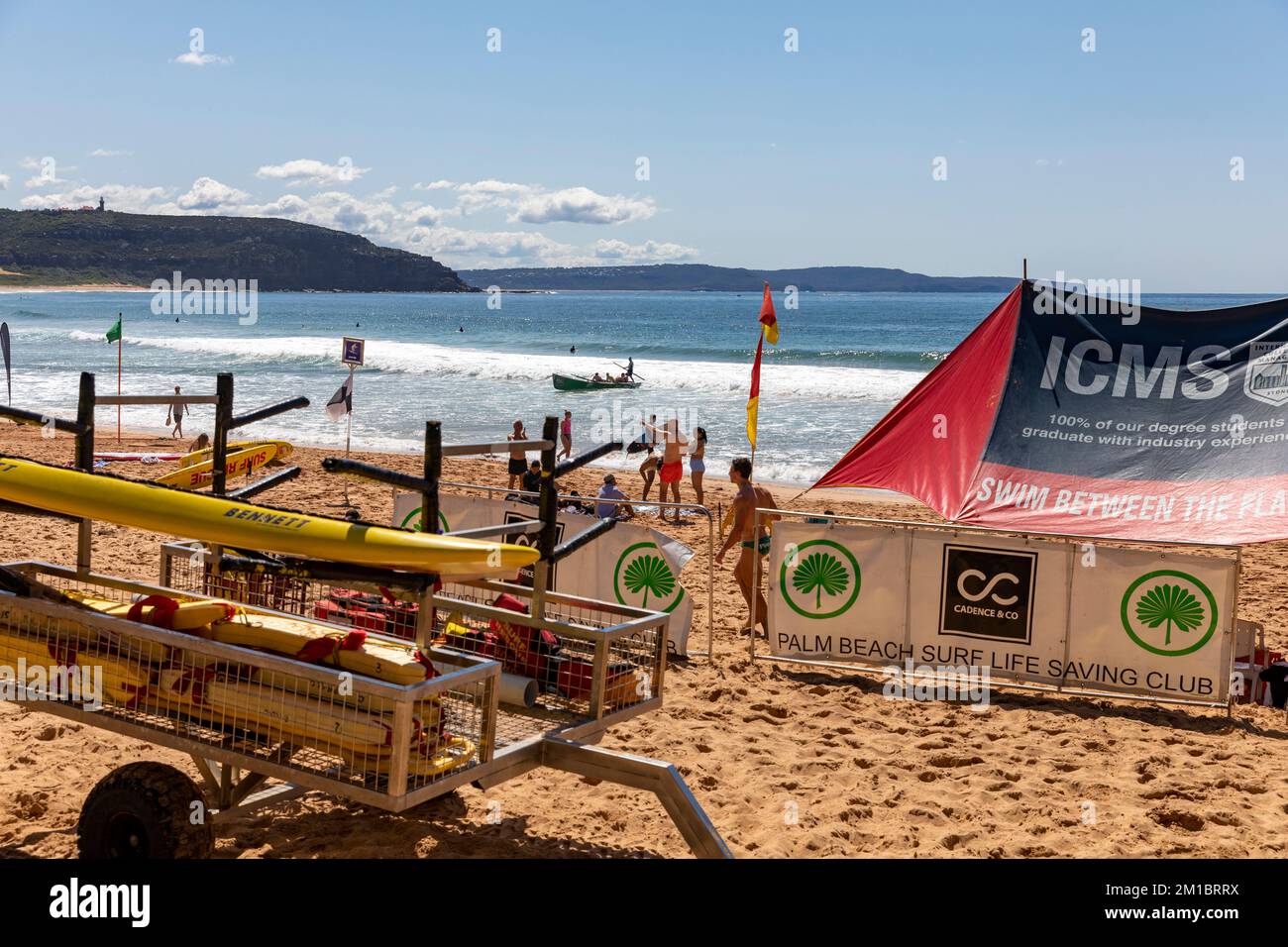 Palm Beach Sydney surf rescue volunteers on the beach beneath shade