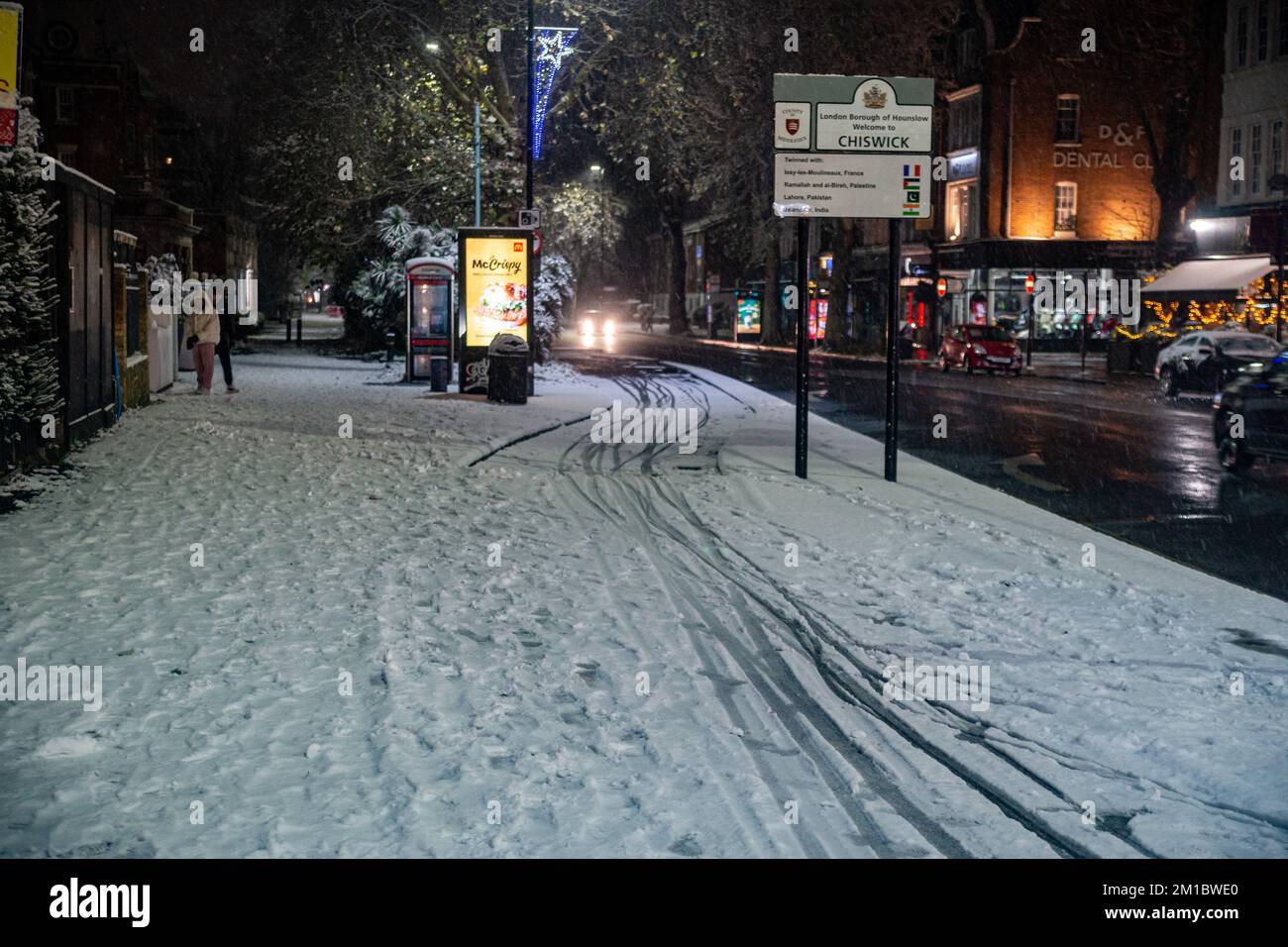 London, UK. 11th Dec, 2022. Snow Envelops Chiswick Mall and the High