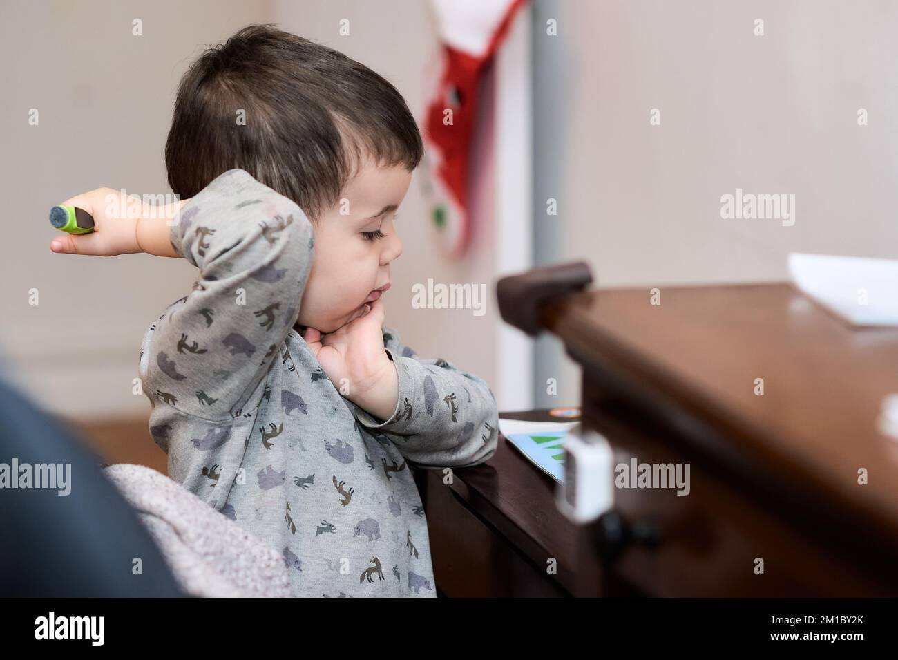 cute baby boy writing in his book Stock Photo