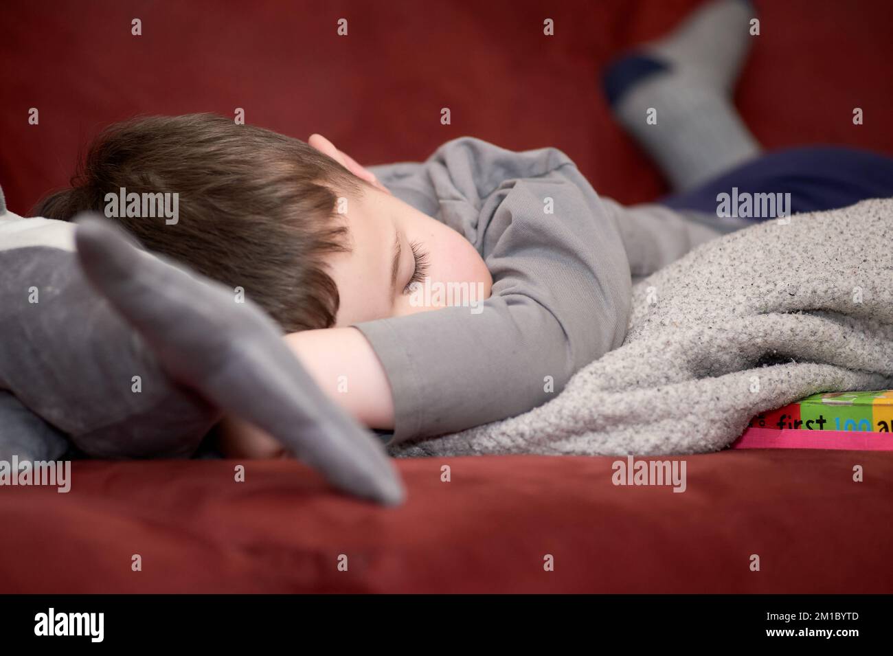 little boy taking a nap on the couch Stock Photo Alamy