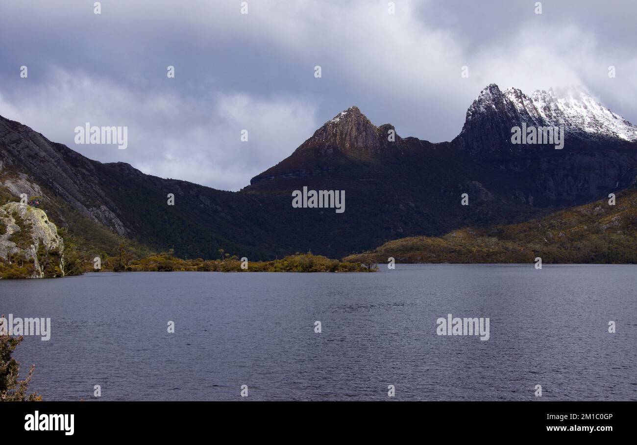 View of Cradle Mountain with glacier rock in mid ground Stock Photo