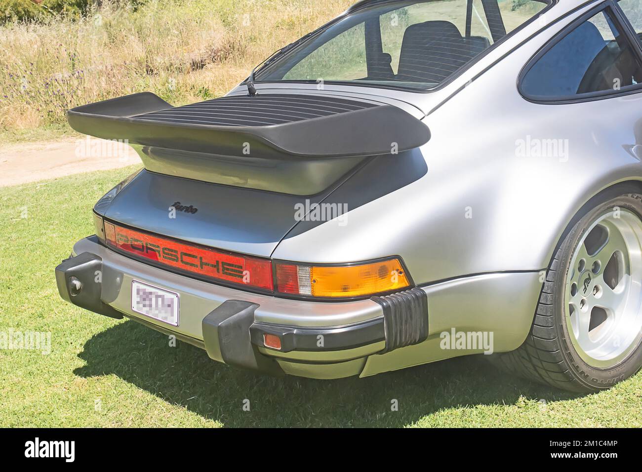 Rear end of a Silver Porsche Turbo 911 (930) Coupe Stock Photo