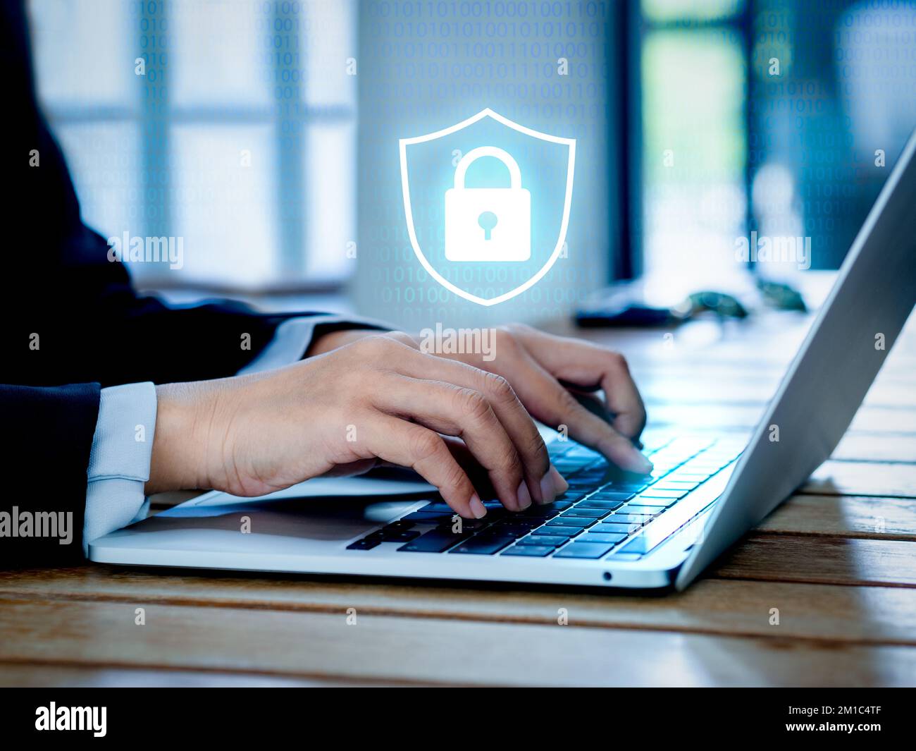 Cyber security system technology and protect concepts. Glowing digital secure padlock virtual icon on binary code with laptop computer while business Stock Photo
