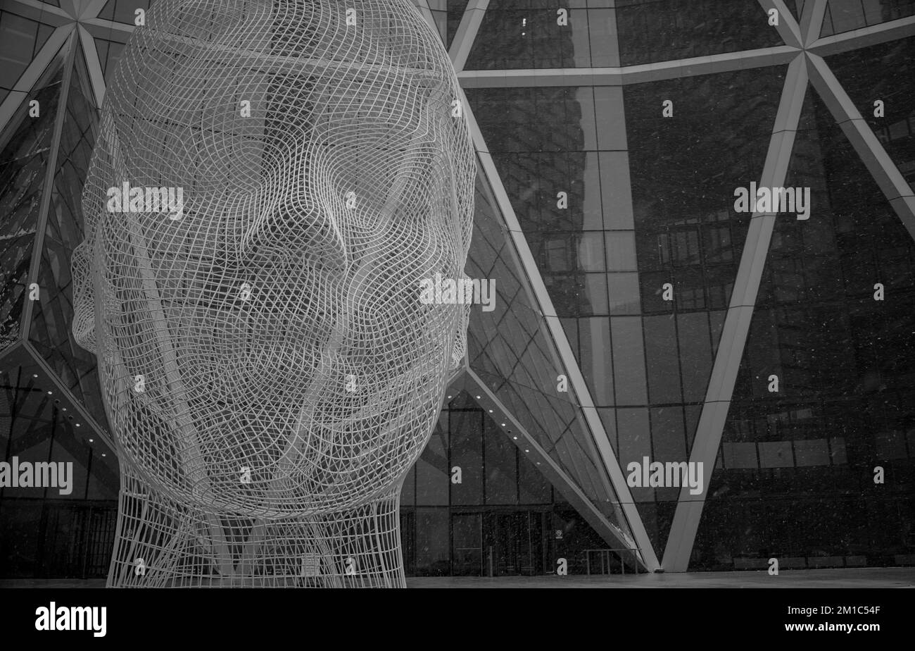 Calgary, Alberta / Canada - December 27 2022: Wonderland Sculpture by Jaume Plensa under the snow Stock Photo