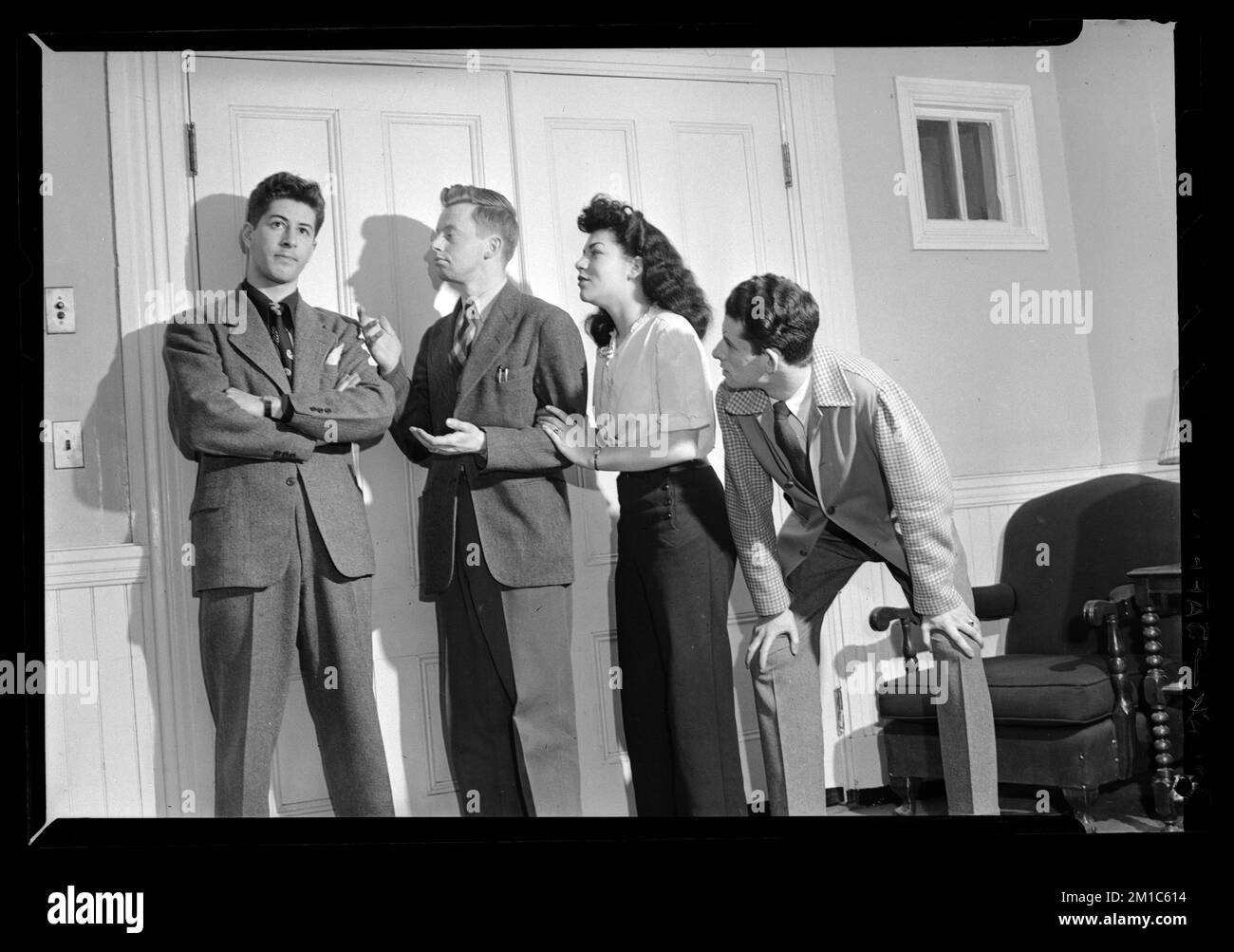 Woman and three men stand posing ,. Jack Miller Collection Stock Photo