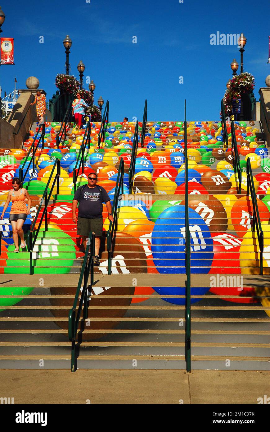The stairs leading to an amusement park also double as a large advertisement billboard for a popular candy candy Stock Photo