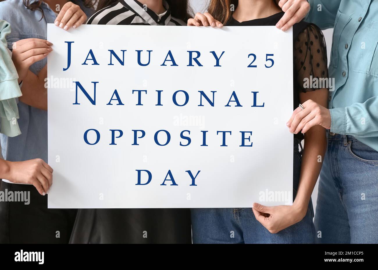 Group of people holding placard with text JANUARY 25 NATIONAL OPPOSITE DAY Stock Photo Alamy