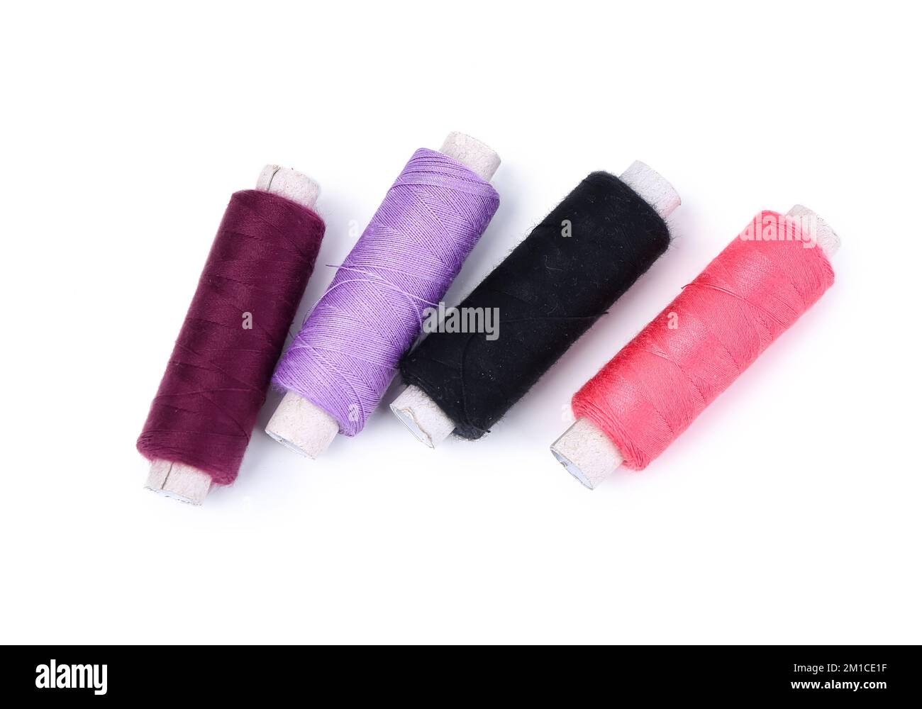 Set of thread spools on white background Stock Photo - Alamy