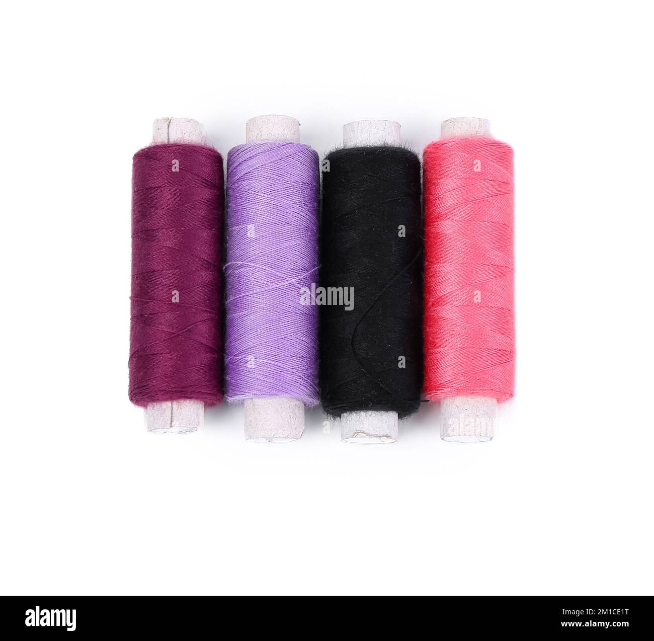 Set of thread spools on white background Stock Photo - Alamy