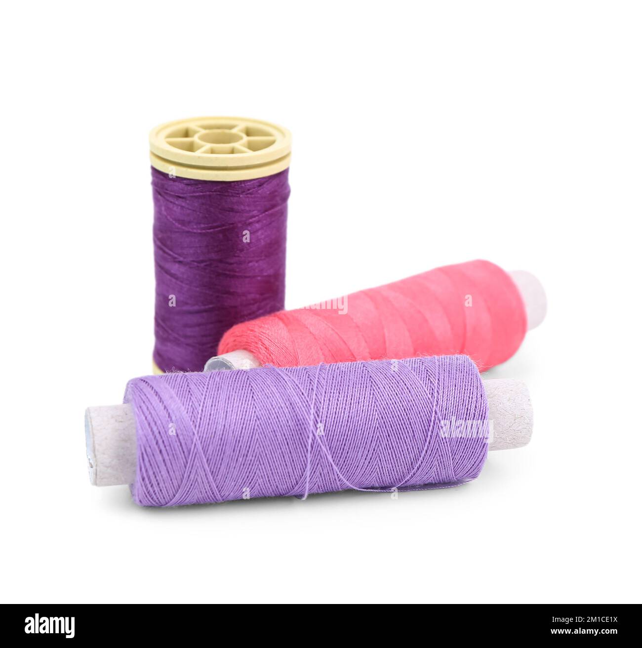 Colorful thread spools isolated on white background Stock Photo - Alamy