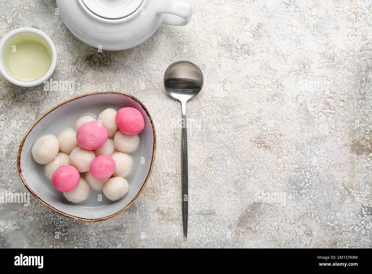 Bowl of tangyuan, cup and teapot on grunge background. Dongzhi Festival ...