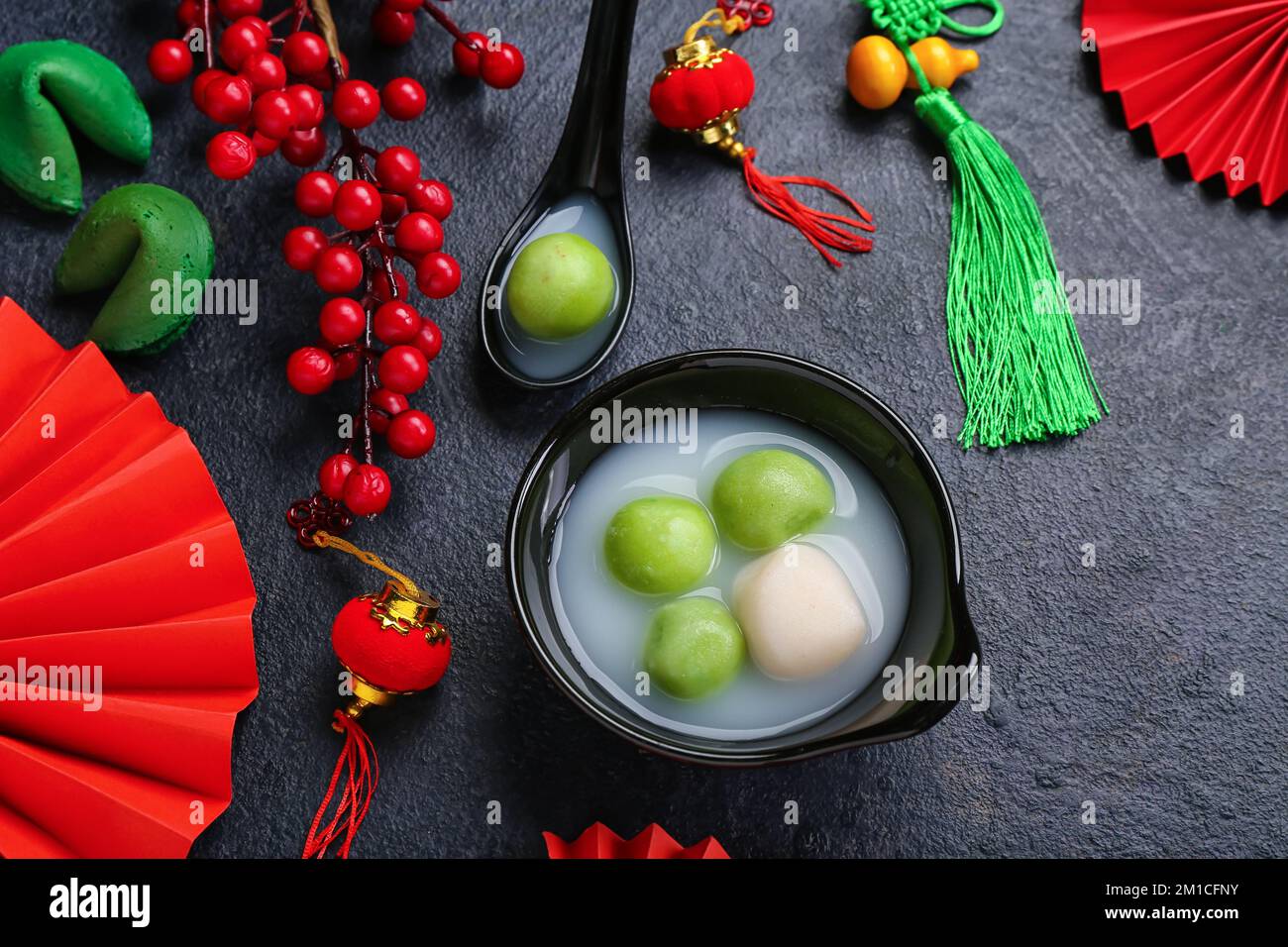 Bowl of tangyuan and Chinese decor on dark background. Dongzhi Festival ...