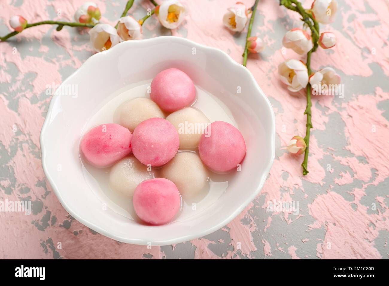 Bowl of tangyuan with sakura on grunge background. Dongzhi Festival ...