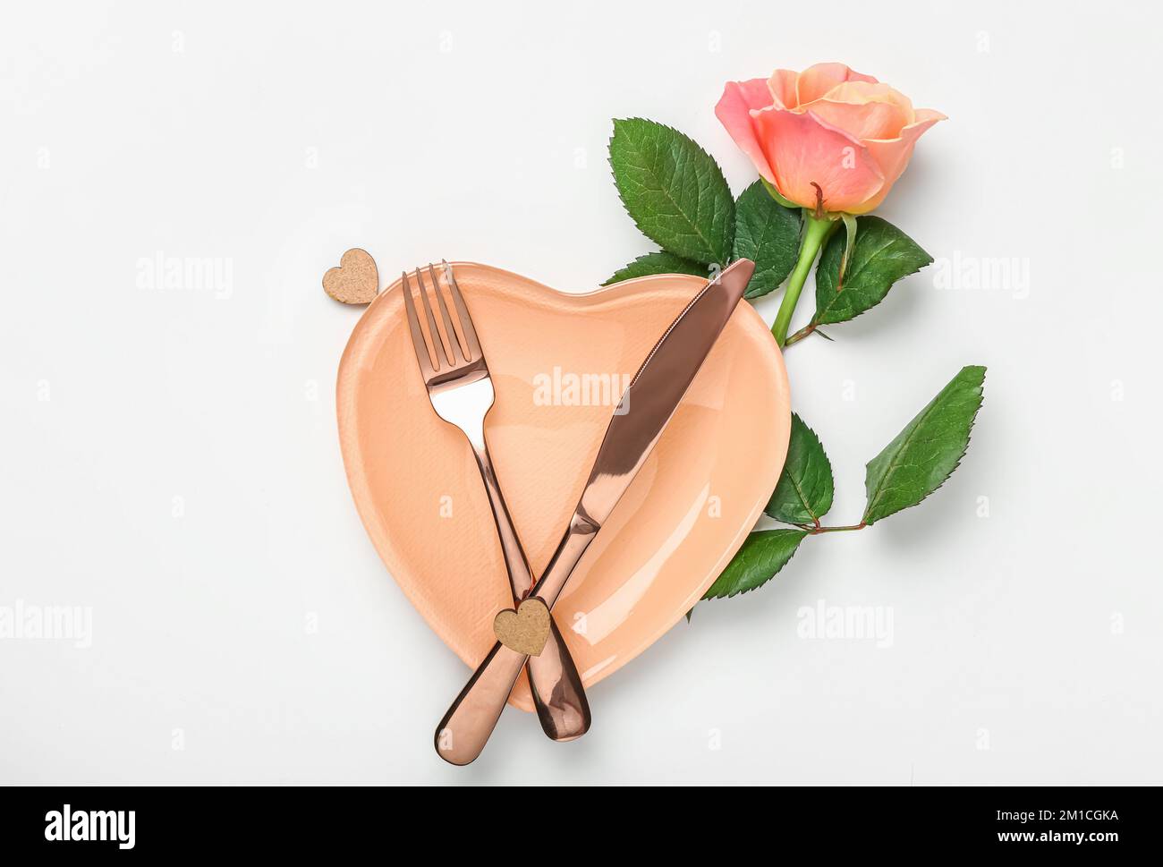 Table setting for Valentine's Day with rose on white background Stock ...