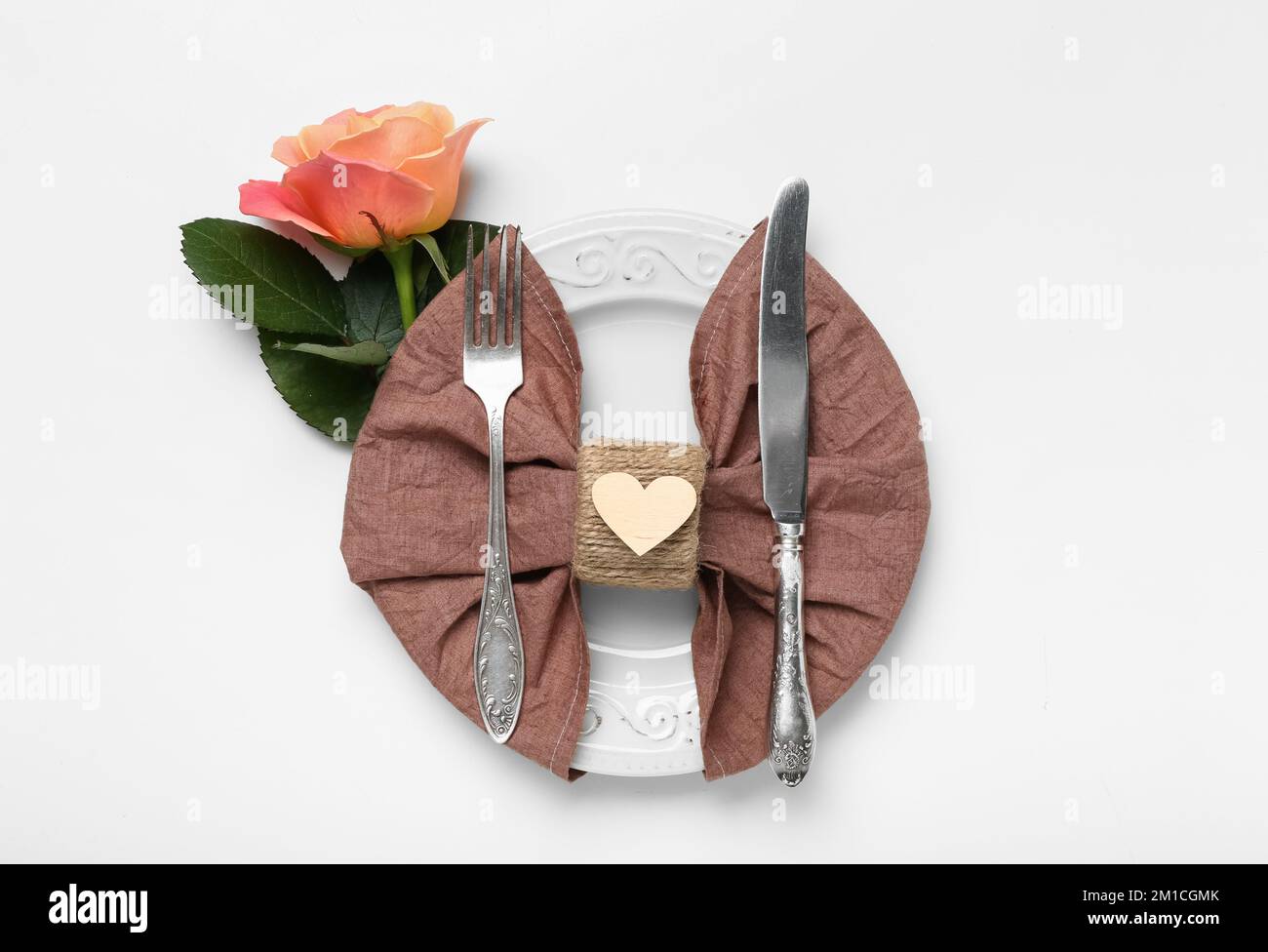 Table setting for Valentine's Day with rose on white background Stock ...