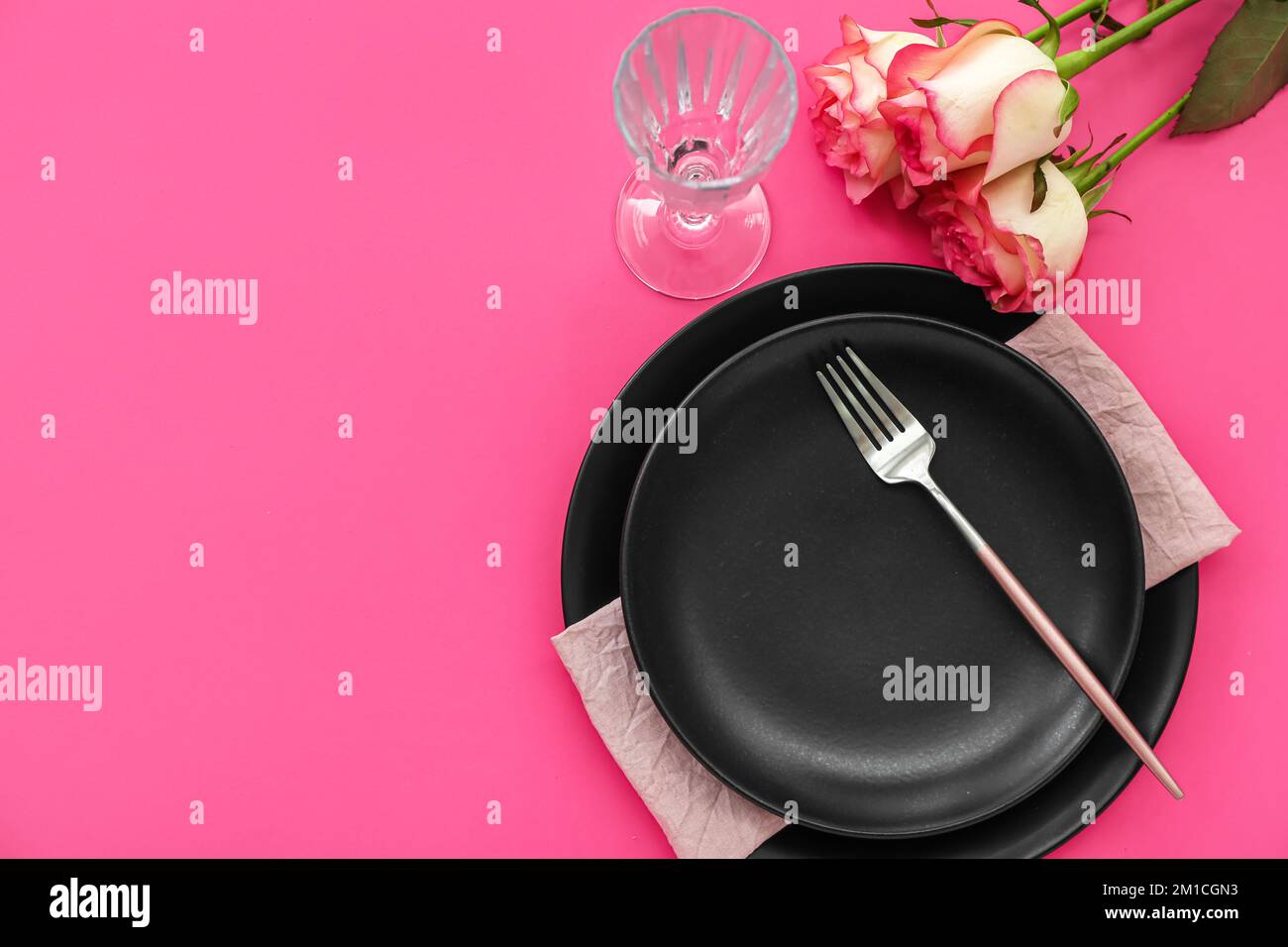 Table setting for Valentine's Day with roses on pink background Stock ...