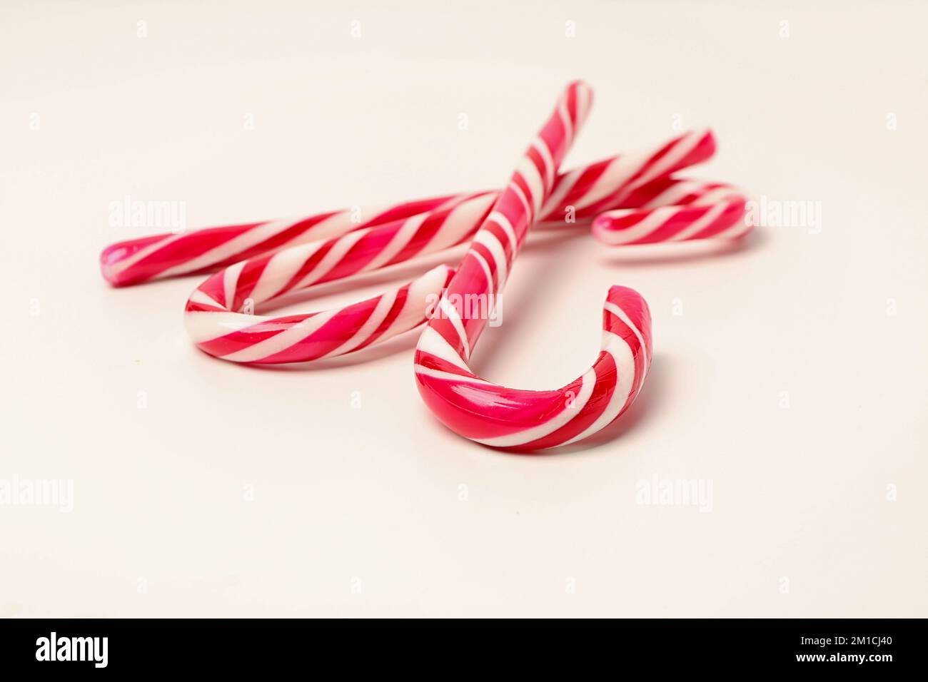 Candy canes isolated on white background Stock Photo - Alamy