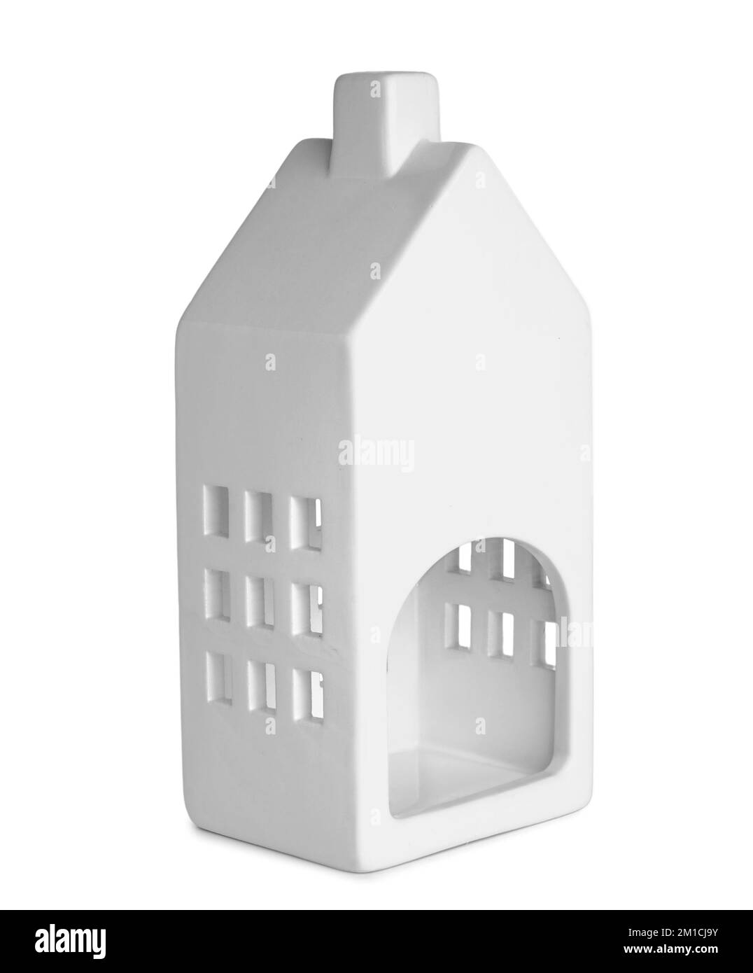Candle holder in shape of house on white background Stock Photo