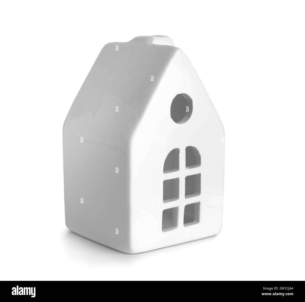 Candle holder in shape of house on white background Stock Photo