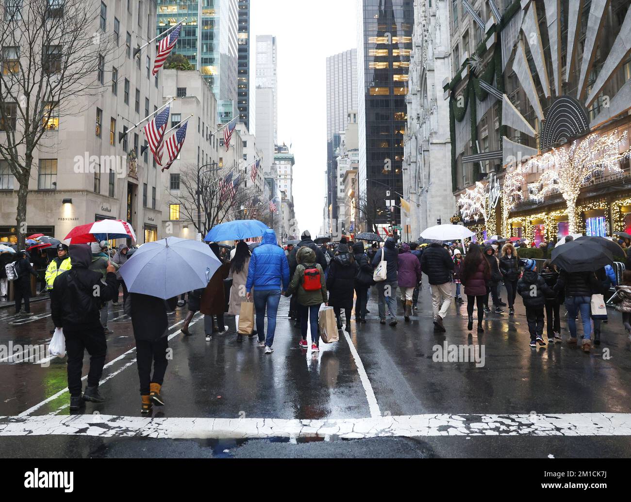 New York, United States. 11th Dec, 2022. Pedestrians and shoppers walk on Fifth Avenue which is closed to automobile traffic by the NYPD on Sunday, December 11, 2022 in New York City. Eleven blocks of Fifth Avenue are closed off to traffic and opened only for pedestrians on December 4th, 11th and 18th from noon to 6 p.m. This is the first time that stretch of Fifth Avenue is turned into a pedestrians only in roughly 50 years. Photo by John Angelillo/UPI Credit: UPI/Alamy Live News Stock Photo