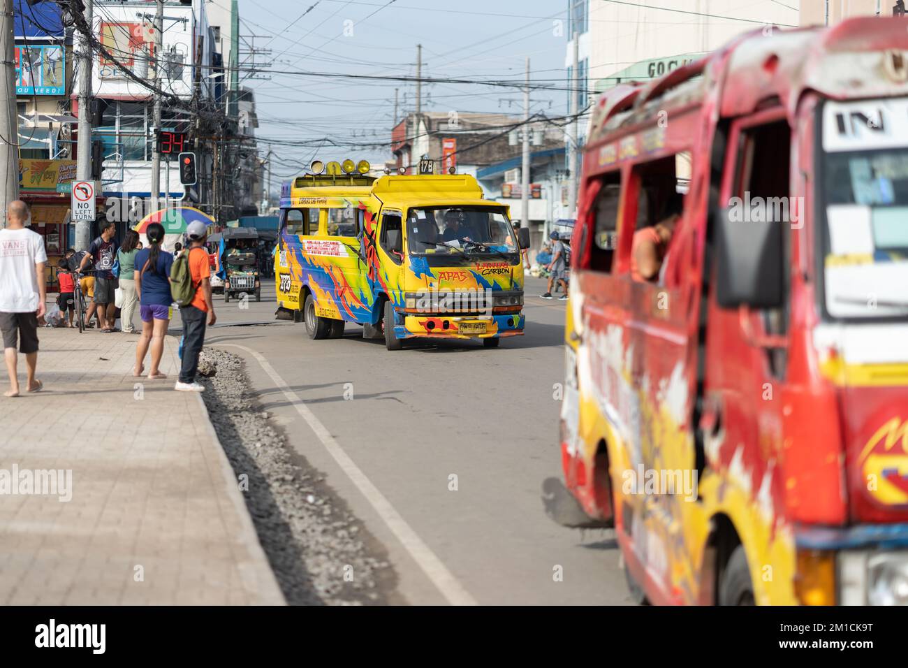 Multicabs are widely used for public transport in the Philippines. These vehicles are adapted, lengthening the chasis to take more passengers. Stock Photo