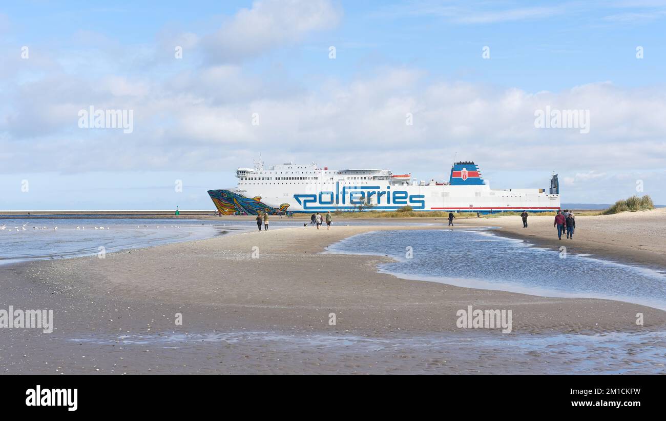 Ferry Cracovia of the ferry operator Polferries on the way from Swinoujscie in Poland to Ystad in Sweden In the foreground the beach of the Baltic Sea. Stock Photo