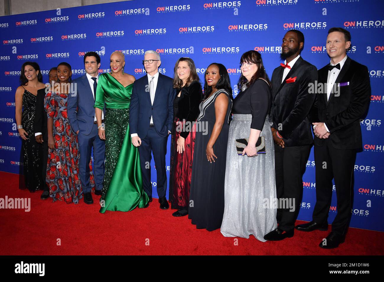 New York, USA. 11th Dec, 2022. Anderson Cooper (C) and CNN Heroes Nora