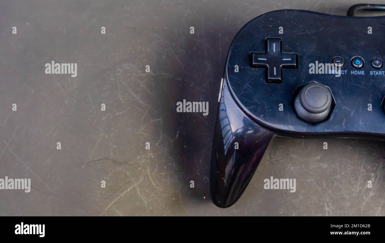 black joystick isolated on black background Stock Photo - Alamy