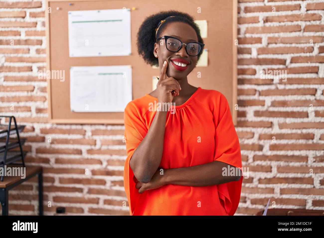African american woman business worker standing with arms crossed ...