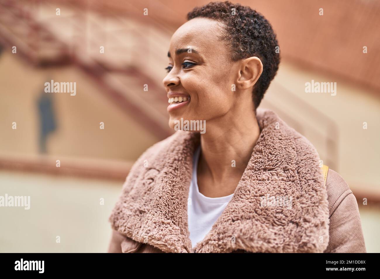 African american woman smiling confident looking to the side at street ...