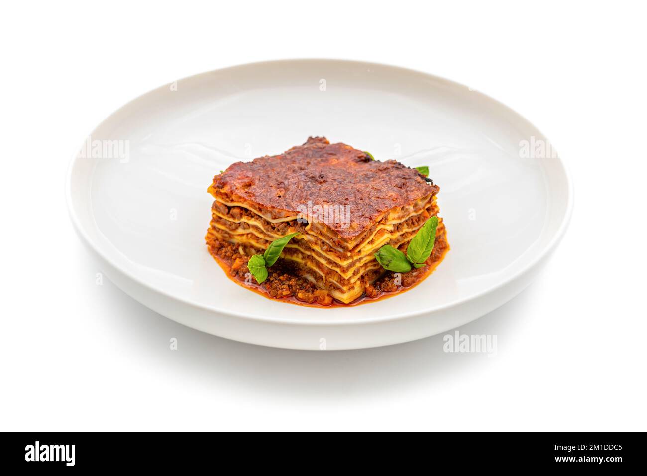 Bechamel sauce and minced meat lasagna on white background Stock Photo