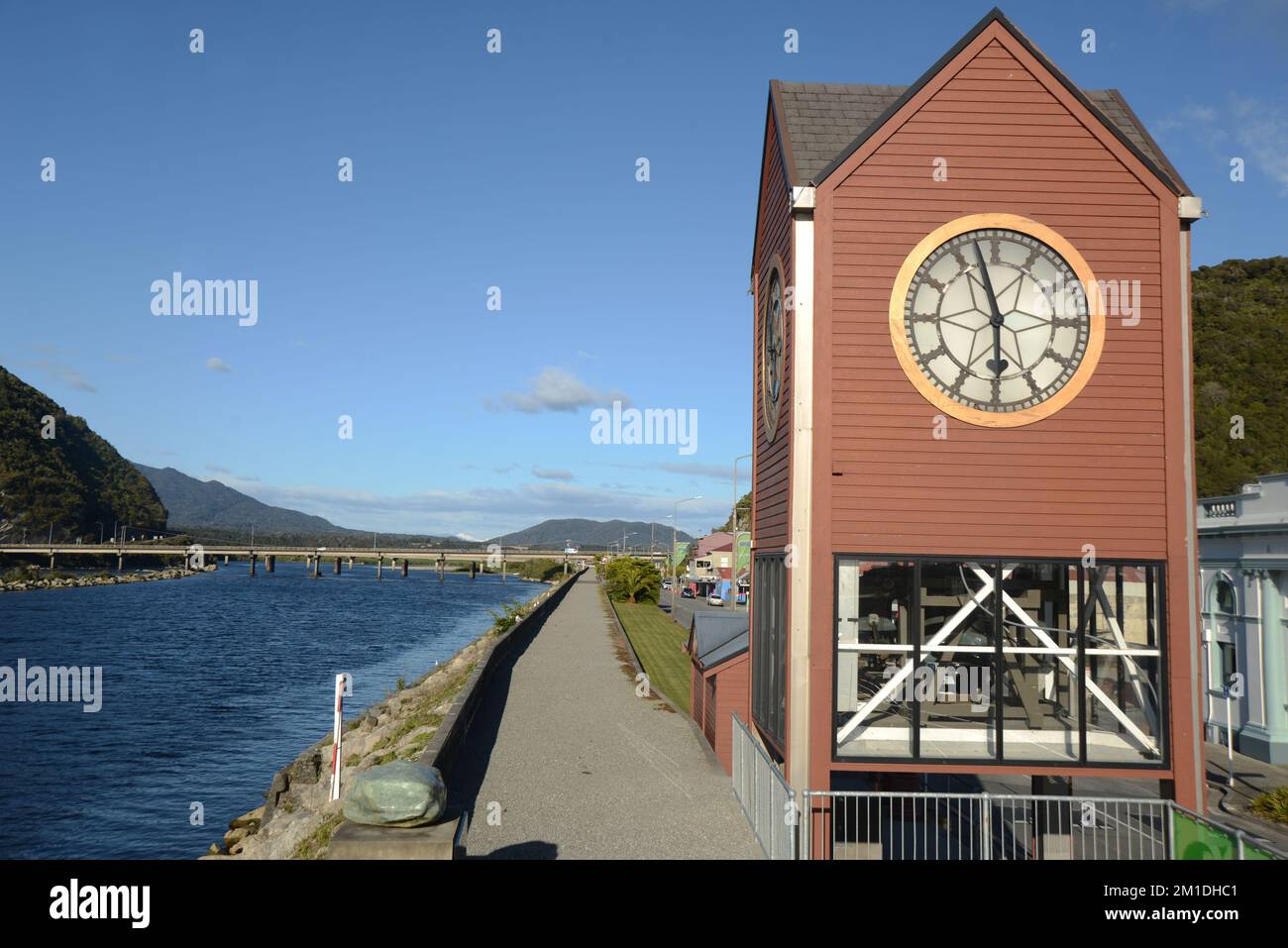 The Greymouth clocktower overlooks the town's central business district and the Grey River and floodwall, known to the locals as the Great Wall of Gre Stock Photo