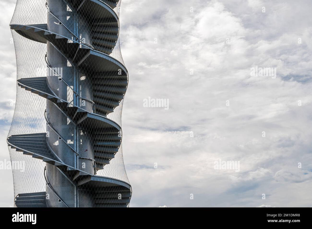 Spiral staircase of the level tower on the Goitzsche near Bitterfeld with copy space in the sky Stock Photo