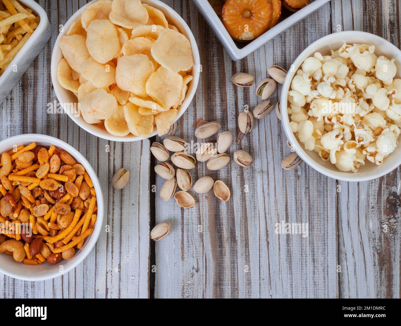 Party snacks, an assortment on rustic wood with copy space Stock Photo ...