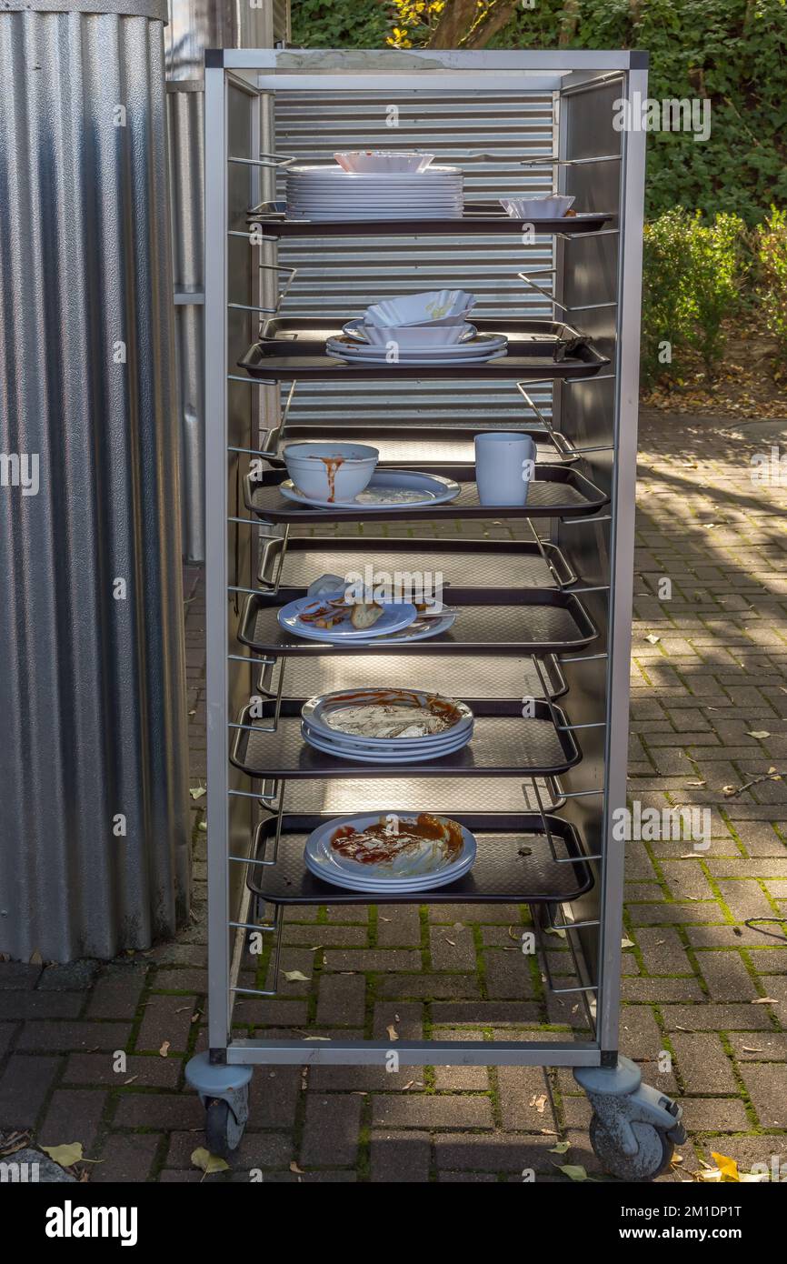 Tray cart with dirty dishes in a gastronomic operation Stock Photo