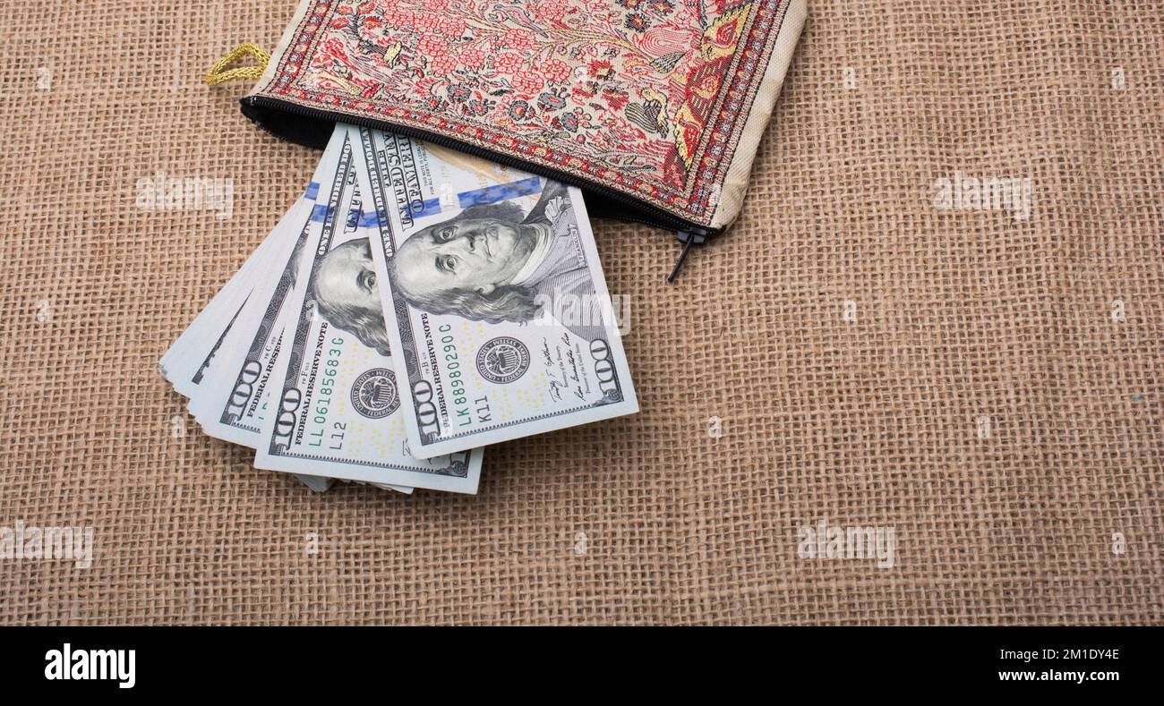 Banknote of US dollar in a purse on a linen canvas Stock Photo - Alamy