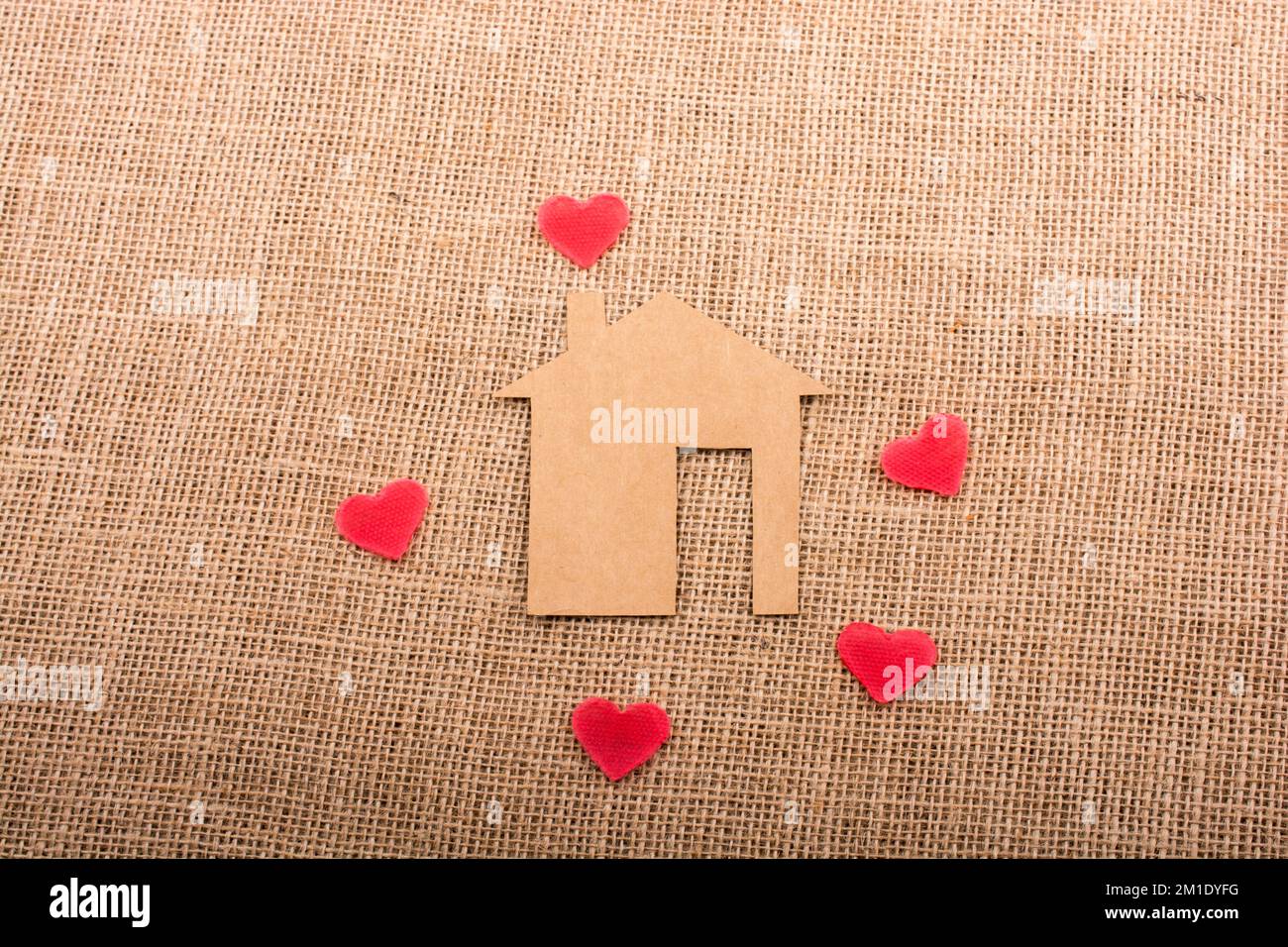 Heart shape around the paper house with a canvas background Stock Photo ...