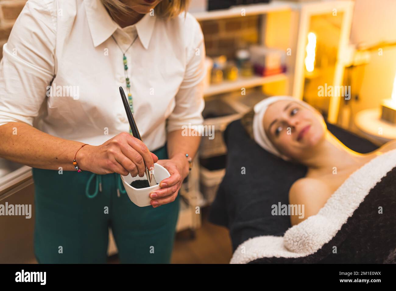 Applying face mask hi-res stock photography and images - Alamy