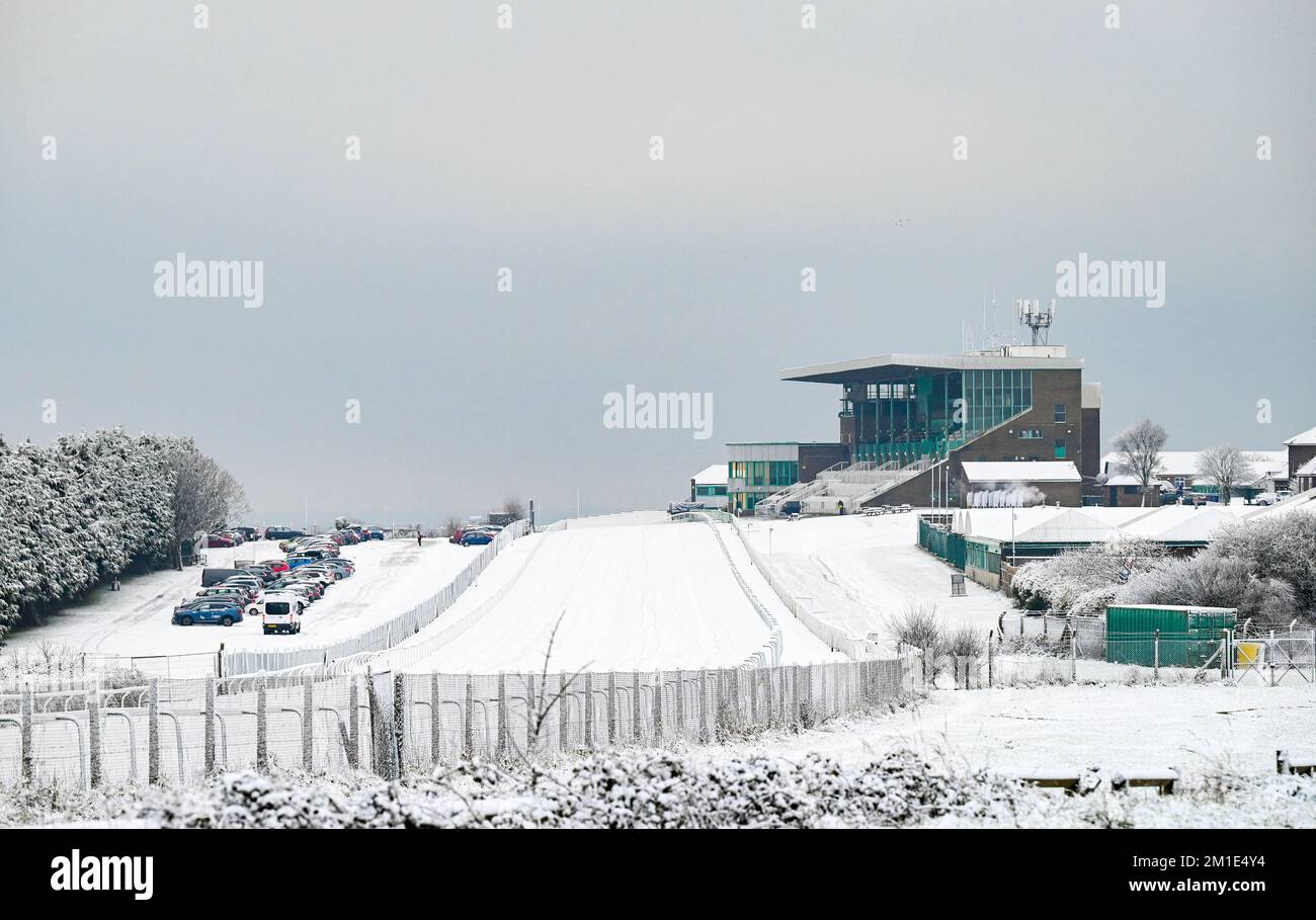 Brighton UK 12th December 2022 -  Brighton Racecourse in the snow this morning as the freezing weather is forecast to last for the next few days throughout Britain . : Credit Simon Dack / Alamy Live News Stock Photo