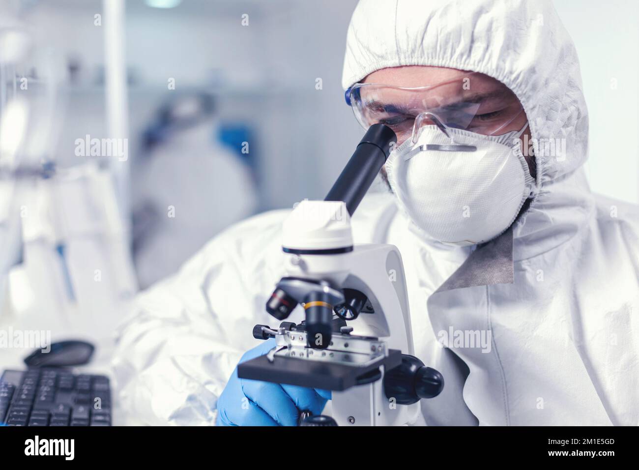 Chemical engineer wearing glasses conducting health investigation on
