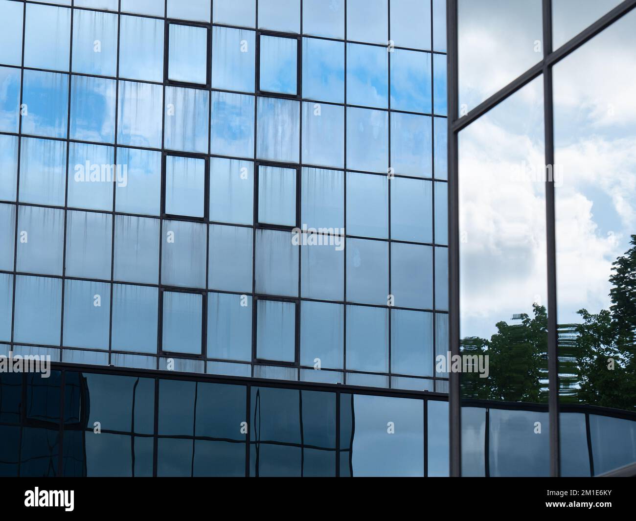 Blue Sky and Clouds Reflected in the Glass Building Stock Photo - Alamy