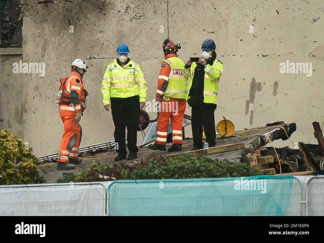 Emergency personnel at the scene of an explosion and fire at a block of