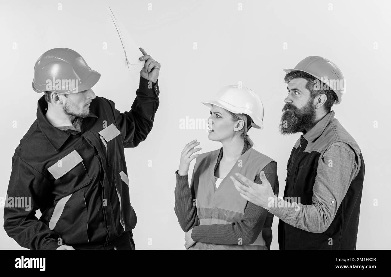 Labor dispute concept. Men in hard hats and uniform Stock Photo Alamy